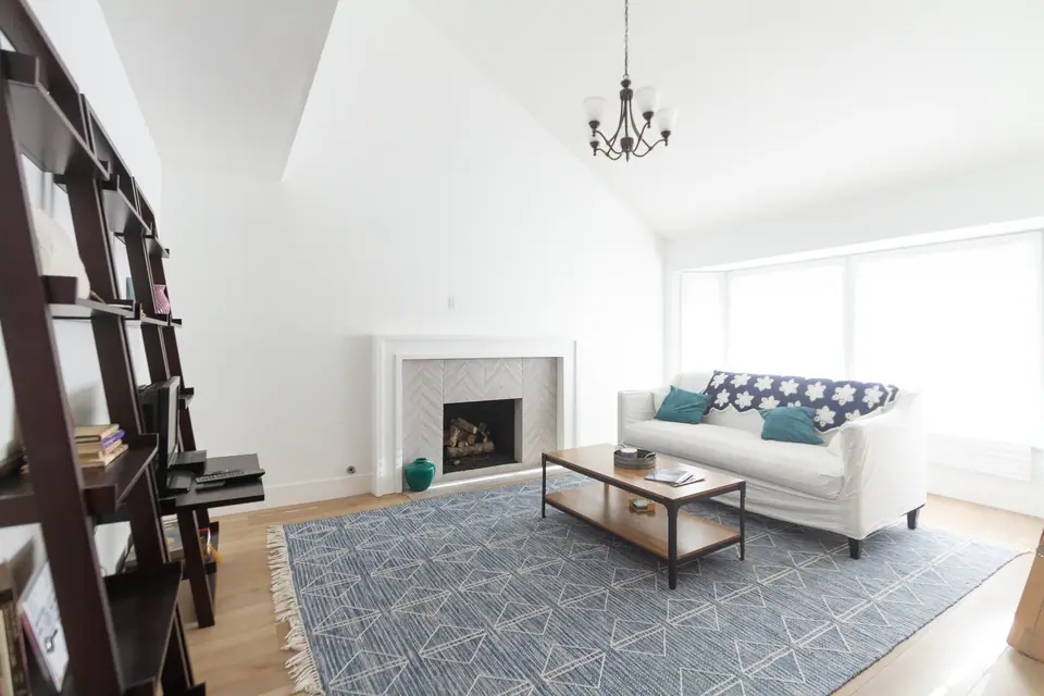 Vaulted great room with fireplace, completed by the team before founding CFC Builders